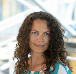 Crystal McMichael in a blue and white striped blouse