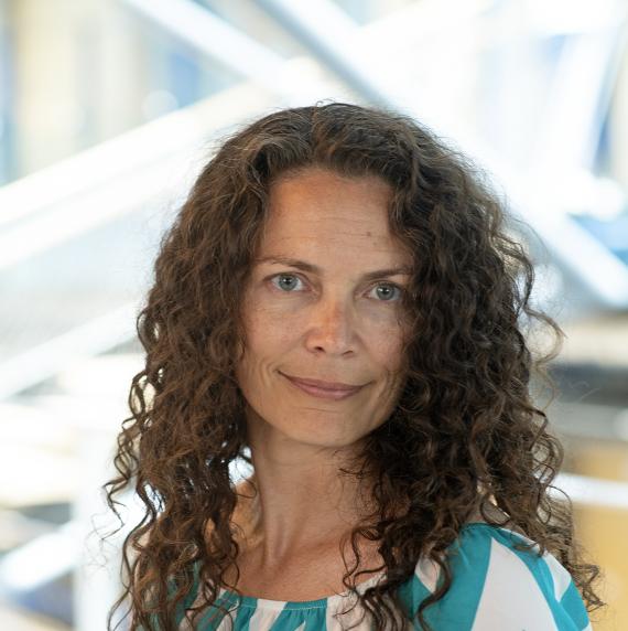 Crystal McMichael in a blue and white striped blouse