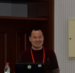 Fanjiang	Kong standing at a lectern, wearing a black jumper and red lanyard