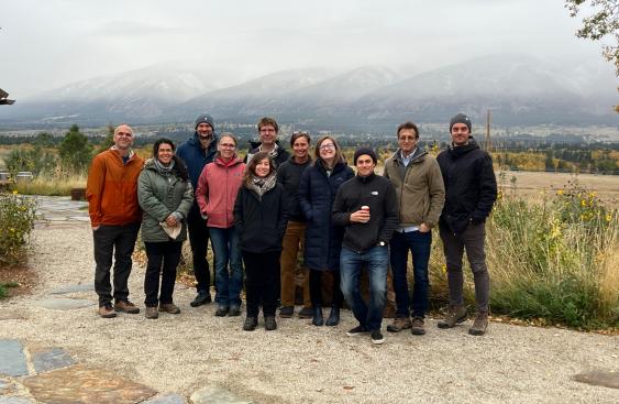 The participants from the 34th New Phytologist workshop, a group of 11 people standing in front of a mountain range