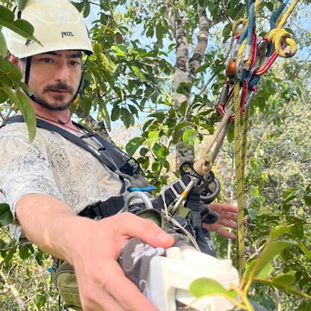 Leonardo using a MultispeQ device developed at Michigan State to measure leaf photosynthesis in the mid-canopy of an Amazonian forest.