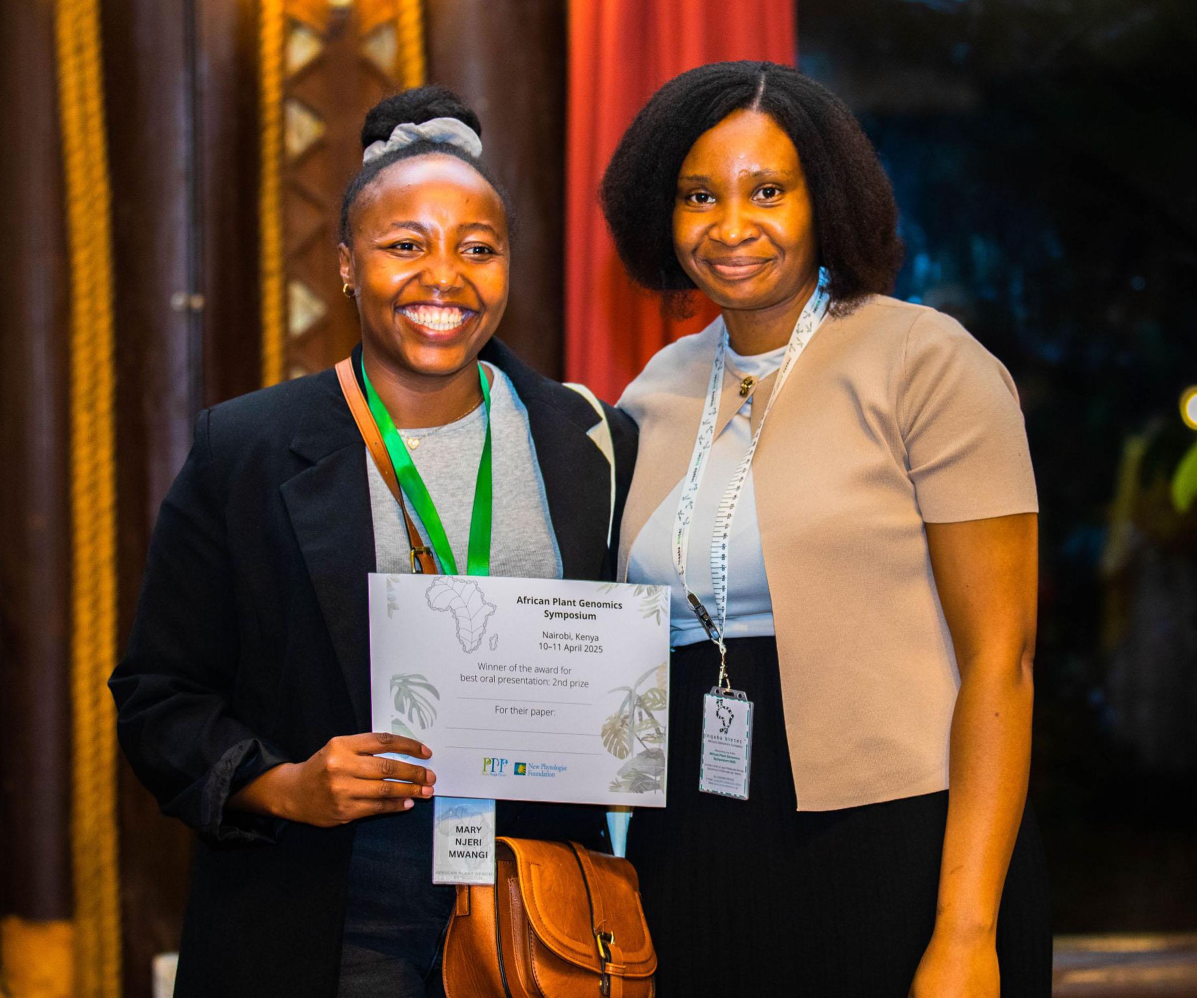 Mary Njeri Mwangi, winner of the second prize for best oral presentation at the African Plant Science Symposium, holding her certificate, with Patience Chatukuta