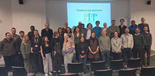 A photo of around 30 conference delegates standing in a group. The sign behind them shows the Plants, People, Planet logo along with the text "Thanks to our sponsors!"