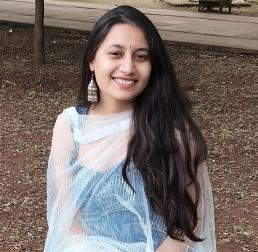 Drishti kataria sat down outdoors, smiling